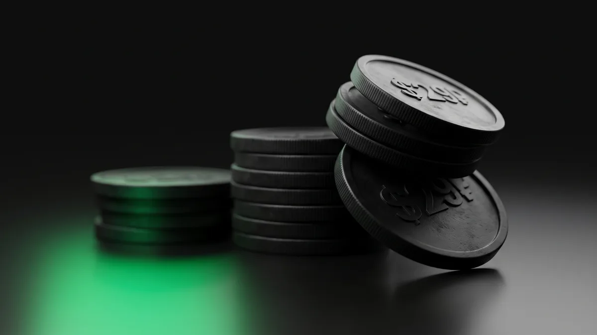 Three stacked matte-black disc coins on a dark surface, the shortest stack glowing emerald green beneath representing the lowest-cost model option